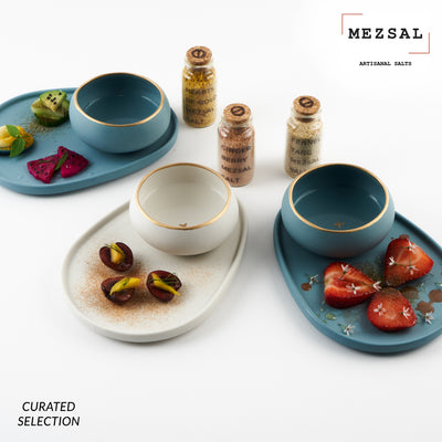 porcelain copitas and plates with mezsal artisanal salts:Hearts of Gold, Fennel Tang, Ginger Berry