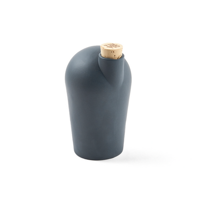 A three-quarter view of a small dark gray porcelain carafe.