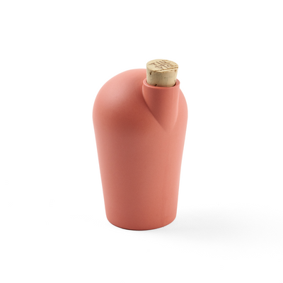 A single pink carafe with a cork stopper. The TUYO logo is lightly branded on the top of the cork stopper.