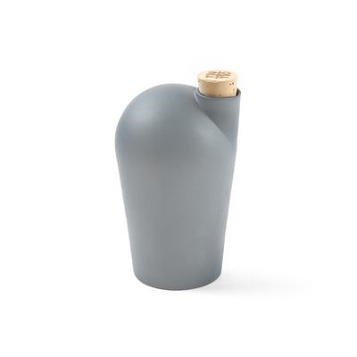 A single light grey carafe with a cork stopper. The TUYO logo is lightly branded on the top of the cork stopper.