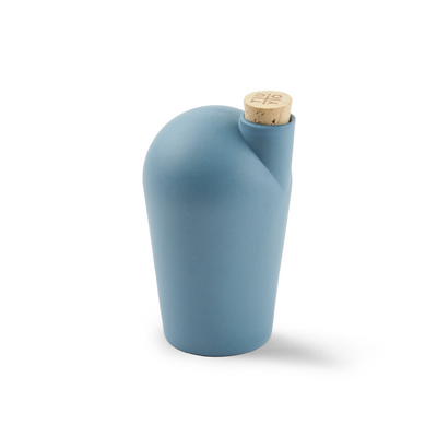 A single turquoise carafe with a cork stopper. The TUYO logo is lightly branded on the top of the cork stopper.