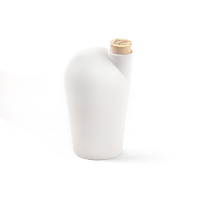 A single white carafe with a cork stopper. The TUYO logo is lightly branded on the top of the cork stopper.