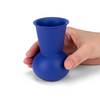 A hand holding a Dark Blue TUYO tequila sipping glass