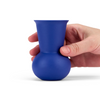 A hand holding a Dark Blue colored TUYO tequila sipping glass