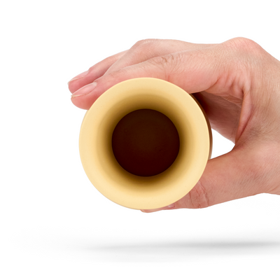 A top view of a Yellow colored TUYO tequila sipping glass