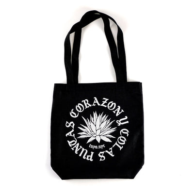 Black cotton totes bag printed on both sides with an agave plant and the words Puntas, Corazon y Colas