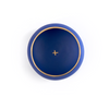 top down view of one dark blue and gold porcelain copita